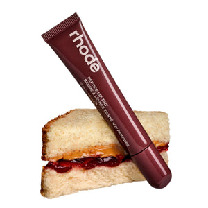 R. Beauty Peptide Lip Tint in PBJ shade, showcasing a vibrant, glossy lip color with a smooth application on natural lips.