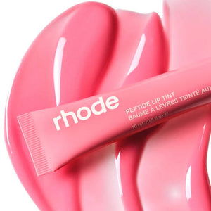 R. Beauty Peptide Liptint in Sweet Pea, natural makeup lip tint with a soft pink hue, applied on lips for a subtle color.