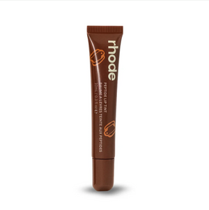 R. Beauty Scented Peptide Lip Tint in Espresso shade, showing a close-up of the makeup product with tinted lips.