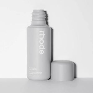 Laylam.ae Glaze Milk makeup product bottle with sleek packaging, showcasing a smooth, creamy texture for a radiant glow.