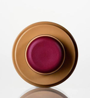 R. Beauty Plum Blush makeup with a soft, matte finish, showing a close-up of the blush applied on a model's cheek.