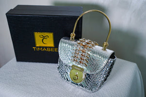 Silver Doko bag by Timabee, stylish and compact bag with a sleek silver finish, featuring a modern design suitable for everyday use.