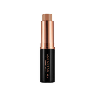 Anastasia Beverly Hills Stick Foundation in Chestnut, a makeup product with a creamy texture and the foundation stick visible.