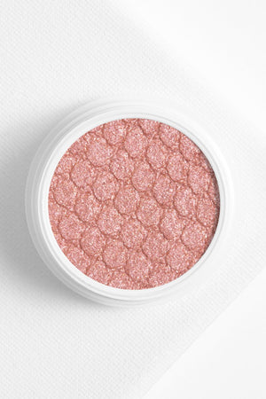Colourpop Polly makeup product with vibrant, colorful packaging and applicator, designed for versatile beauty looks.