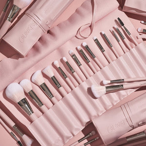 Colourpop Smoke 'n Roses makeup brush roll with multiple brush slots in black and pink floral design.