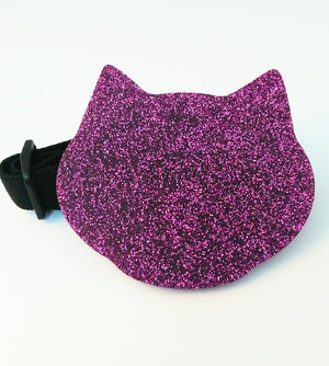 Pink glitter kitten paw makeup palette by Paw Palette with sparkly pink design and paw print details.