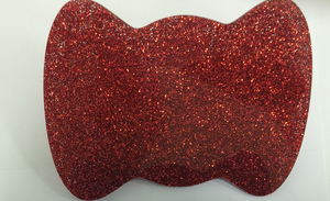 Red glitter bow paw makeup brush from Paw Palette featuring a shiny red glitter bow design.
