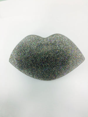 Silver Glitter Smooches makeup product by Paw Palette featuring shiny silver glitter and playful packaging.