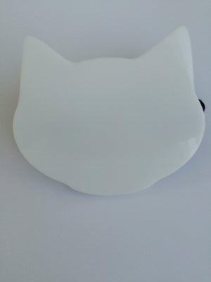 White kitten paw makeup brush from Paw Palette featuring soft white bristles and a cute paw-shaped handle.